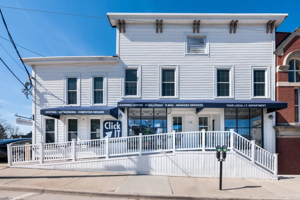 Chagrin Falls Click IT storefront, a managed IT support provider in a white building with ramp access.